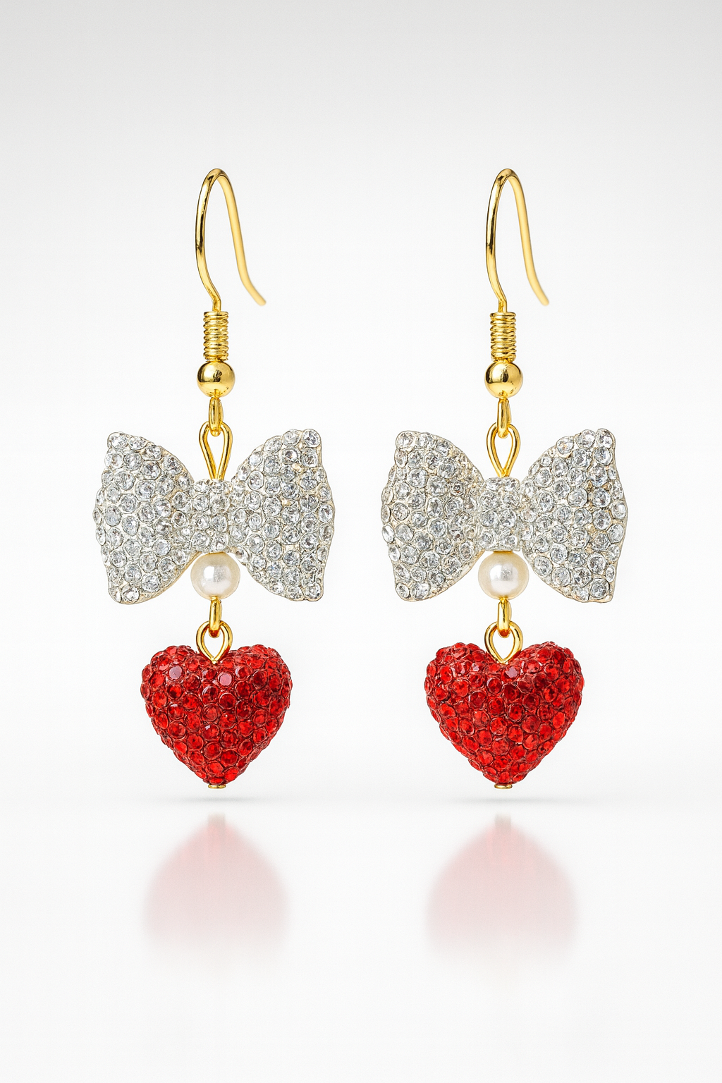Grace-Tied Hearts Earrings with sparkling crystal bows and red hearts on gold hooks — faith-inspired, hypoallergenic jewelry symbolizing love and grace.
