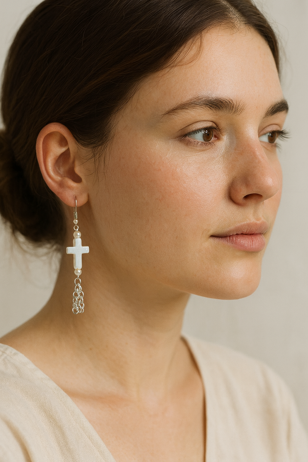 Faith-inspired Broken Chain Earrings featuring white cross and pearl accents with silver chain dangles — symbolizing freedom and grace through Christ.