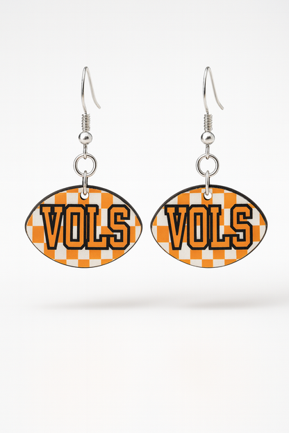 “Orange and white checker football-shape earrings with nickel-free hooks on white background”