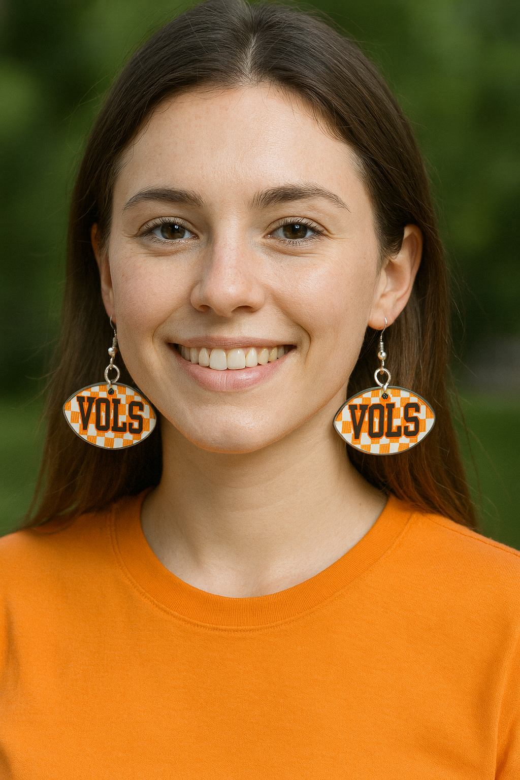 “Side angle of lightweight football-shape game-day earrings showing fish-hook wires”