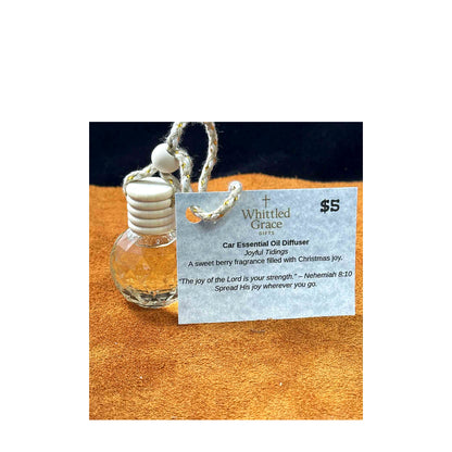 “Car essential oil diffuser with Joyful Tidings tag, sweet berry scent.”
