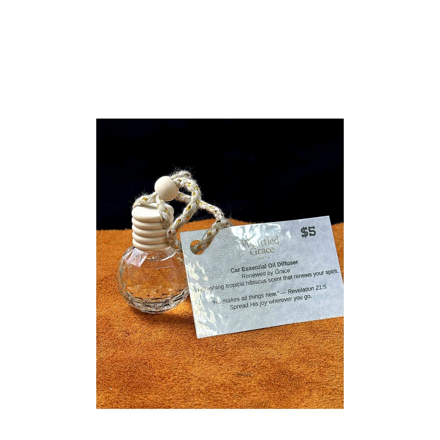 “Car diffuser with Renewed by Grace tag, tropical hibiscus scent.”