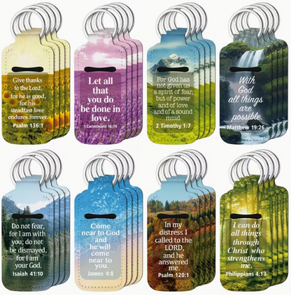 Set of 8 Scripture ChapStick Holder Keychains featuring Bible verses with mountain and nature backgrounds. Includes Psalm 136:1, 1 Corinthians 16:14, 2 Timothy 1:7, Matthew 19:26, Isaiah 41:10, James 4:8, Psalm 120:1, and Philippians 4:13.